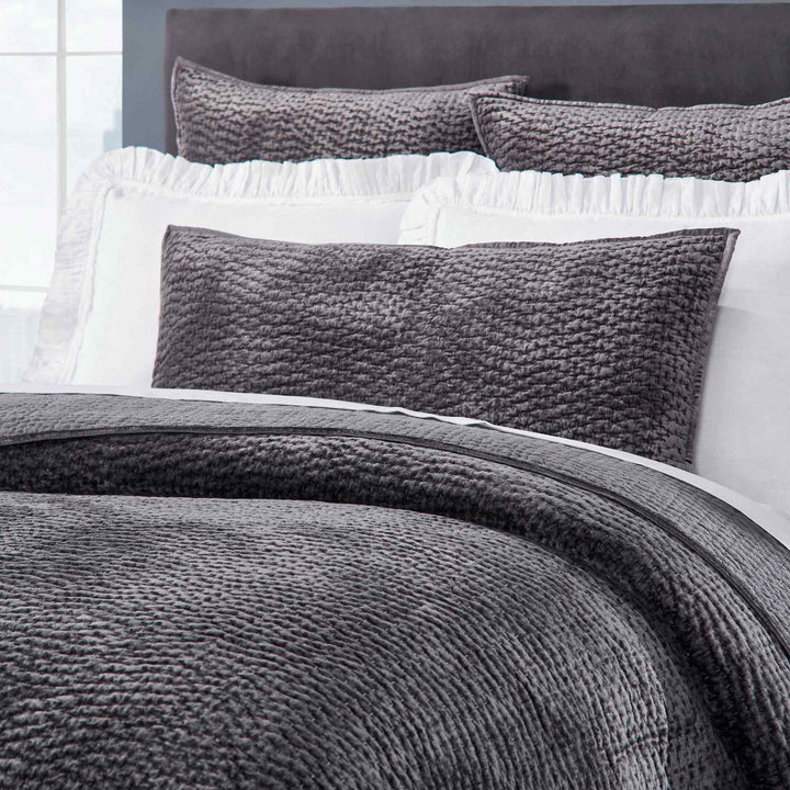 CL-184-9496_3|Detailed view of a dark gray textured coverlet and matching plush pillows, highlighting their soft, inviting texture.