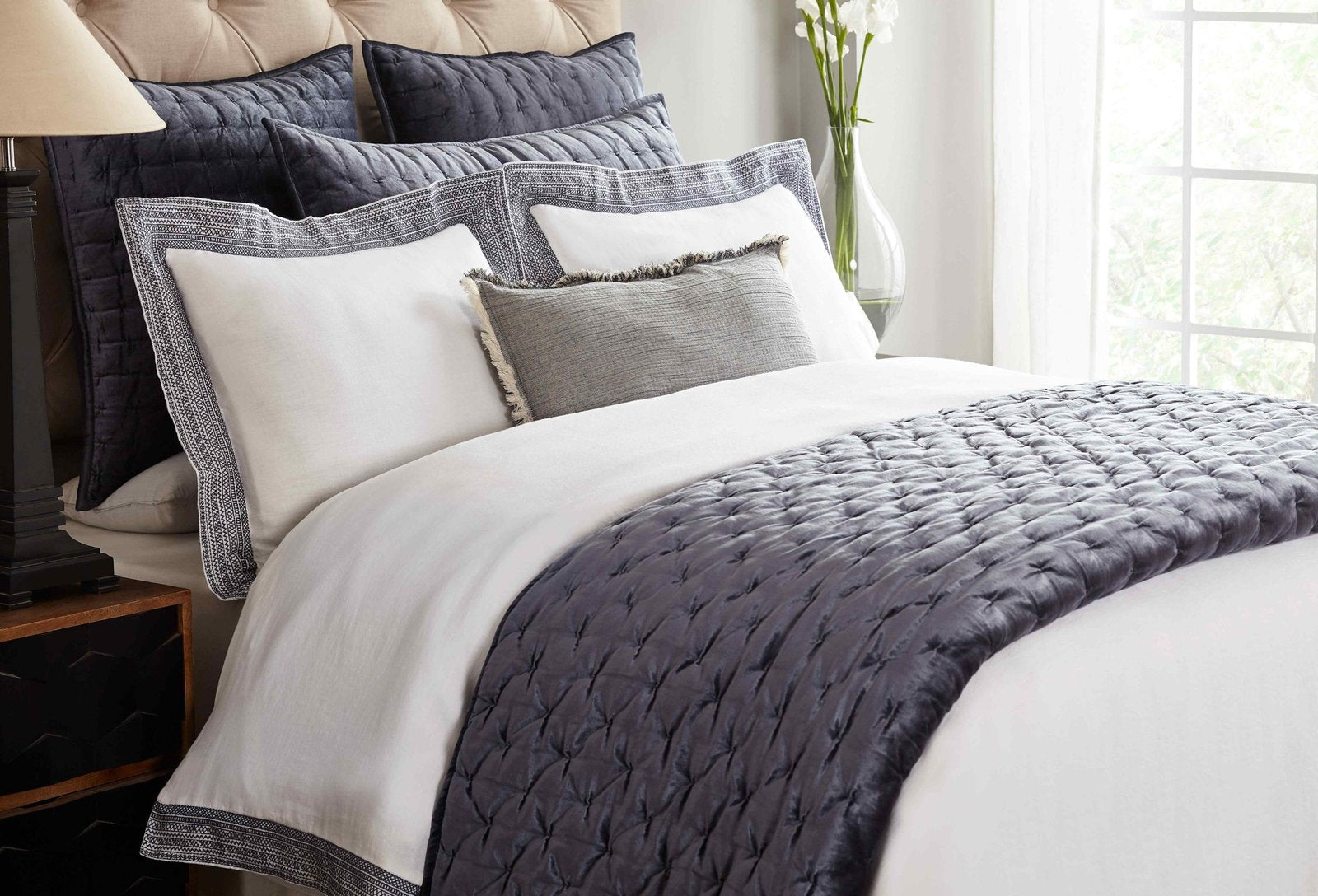 QT-313-11096_3|Chic dark gray velvet quilted quilt at the foot of a bed, offering a stylish layer of comfort and modern elegance to the room.