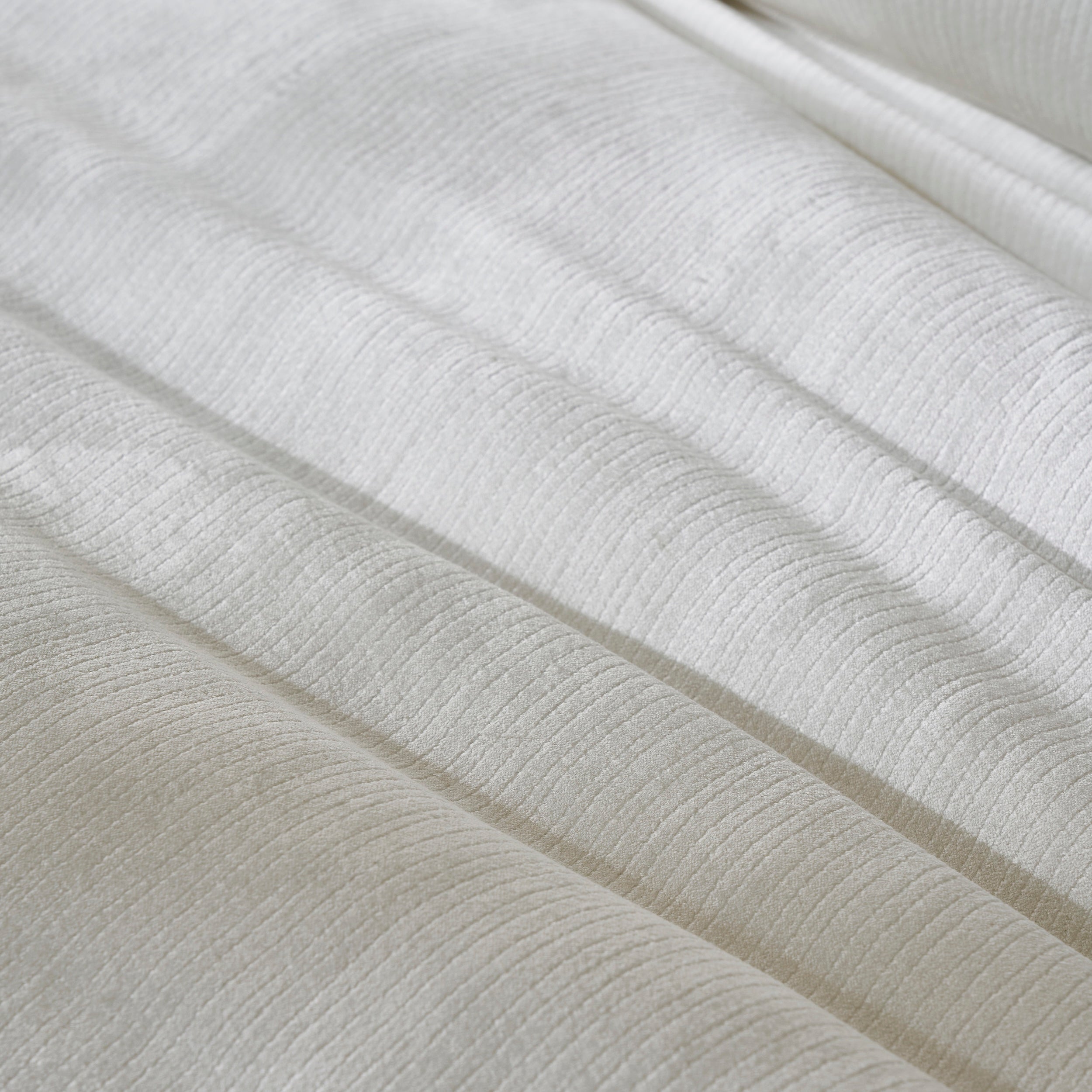 DT-052-10692_6|Elegant white textured duvet cover fabric, softly folded to reveal its subtle striped pattern and luxurious feel.