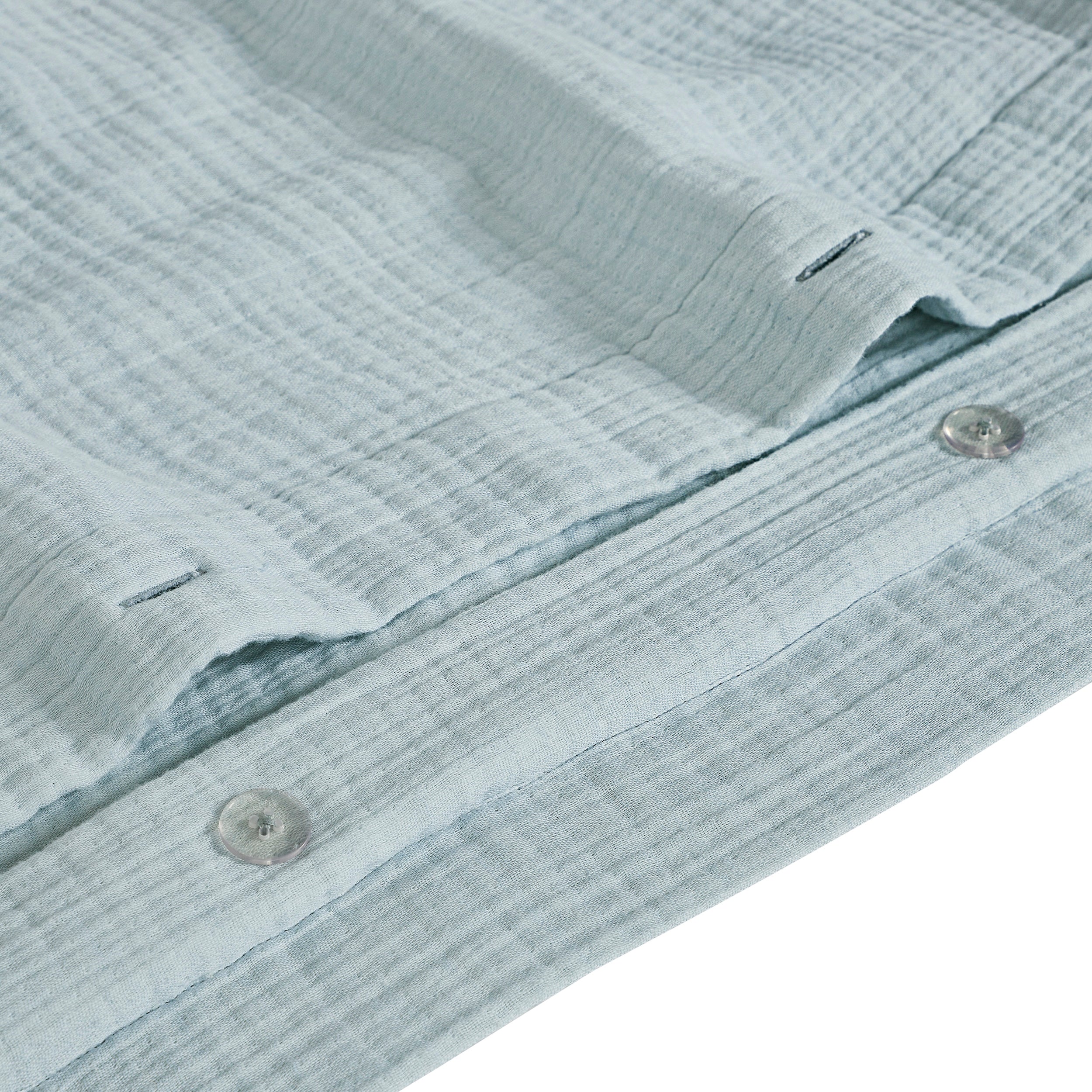 DT-050-10692_9|Close-up of light blue textured cotton duvet cover with button closure, soft crinkle fabric bedding detail.