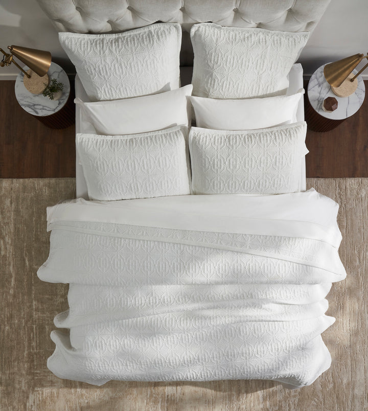 QT-376-9496_4|Top-down view of white quilted bedding, geometric pattern. Cozy and elegant quilt for a modern bedroom, adds sophisticated style.