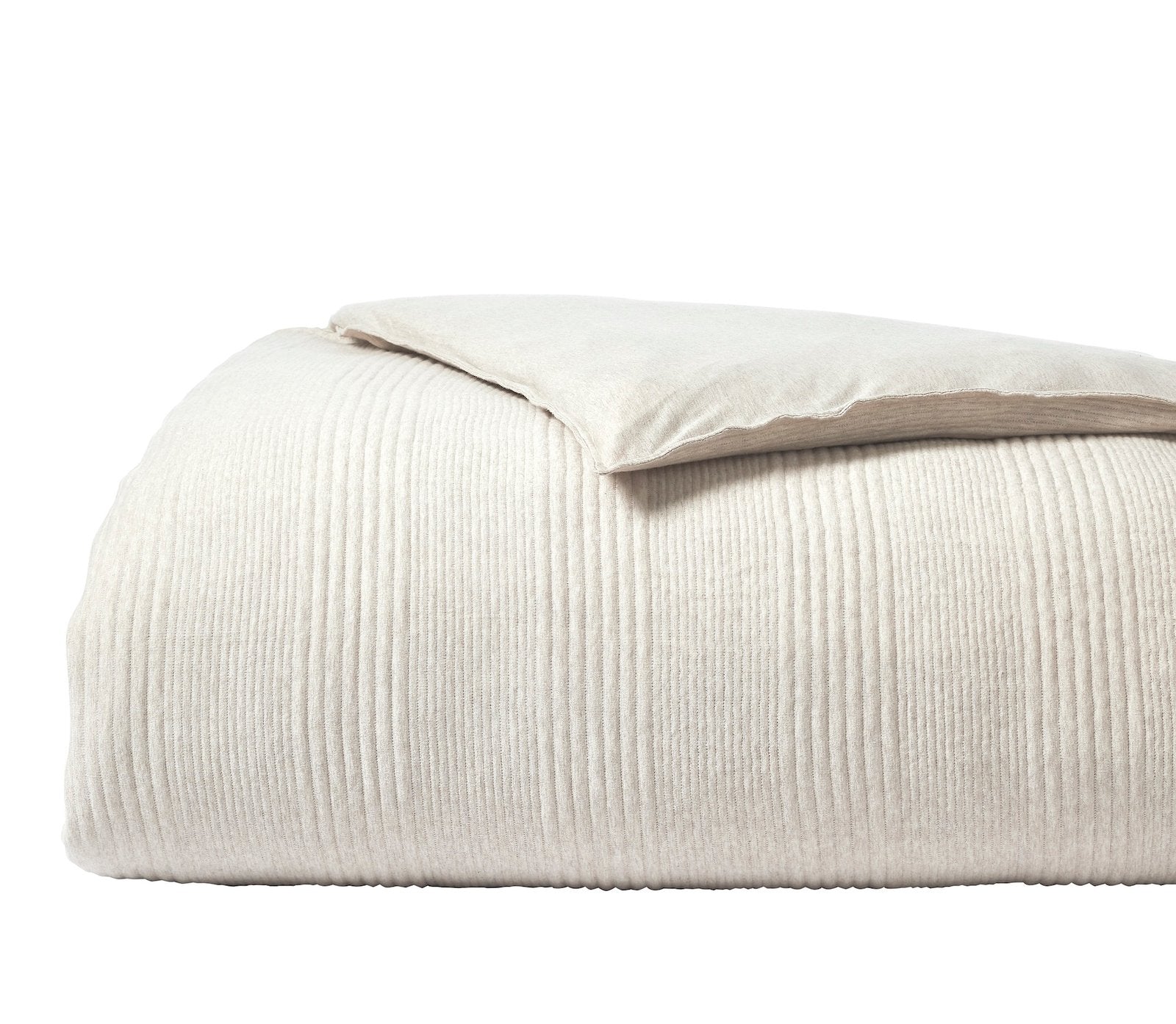 DT-040-9092_5|Clean beige textured duvet cover, vertically ribbed fabric, neatly folded with a matching pillow on top, simple elegance.