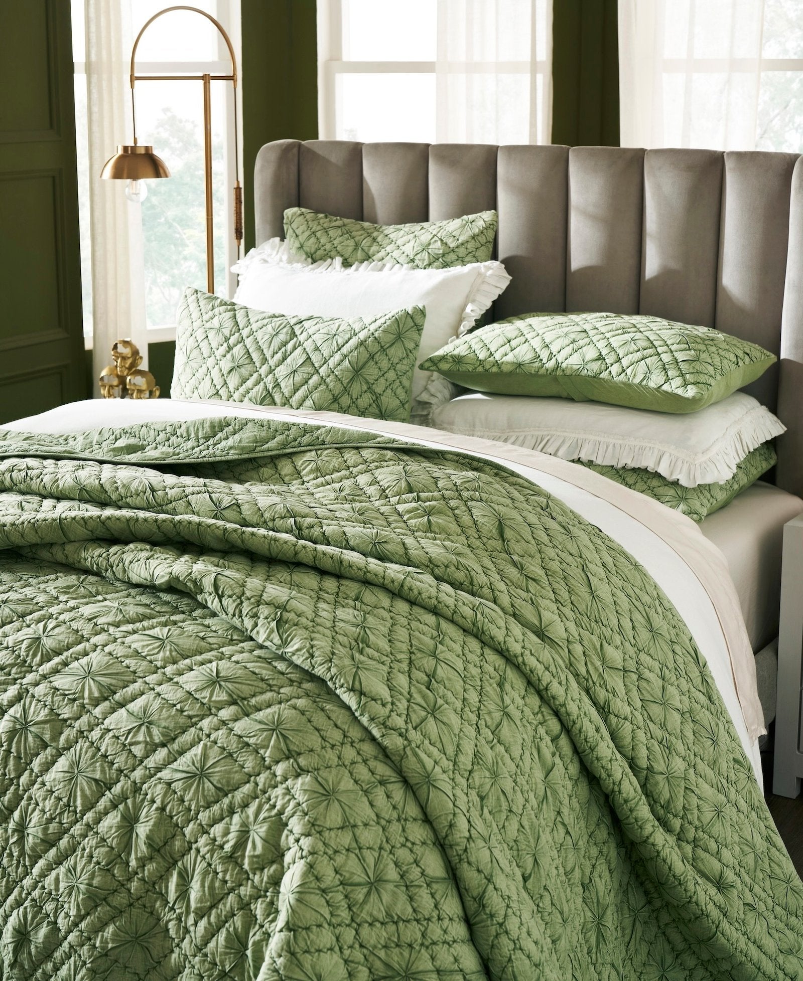 QT-366-11096_3|Close-up of a vibrant green textured quilt set showcasing intricate geometric patterns, adding a refreshing and cozy feel to the bed.