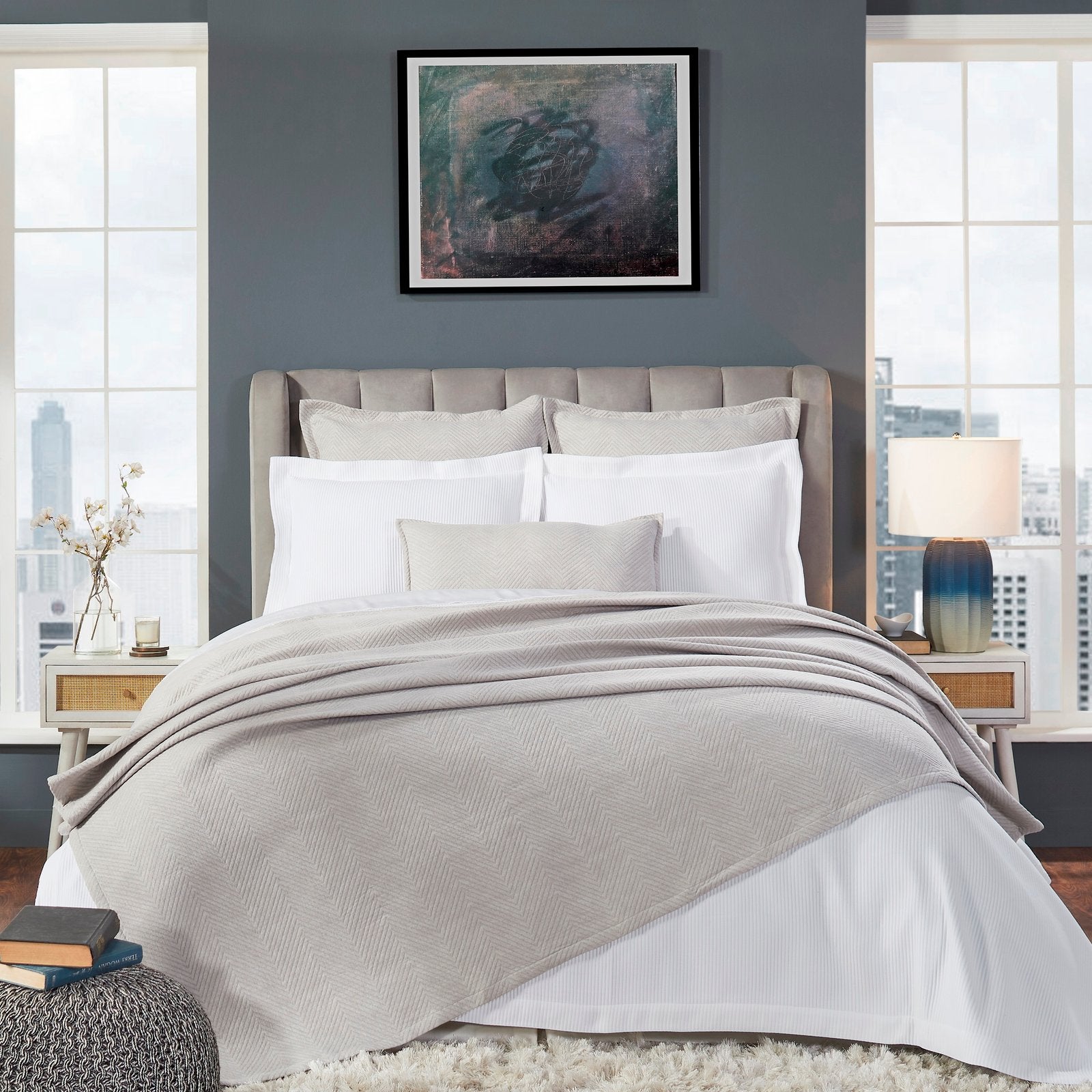 BT-121-9496_1|Stylish grey herringbone blanket elegantly draped over a bed, offering chic texture and cozy warmth for modern spaces.