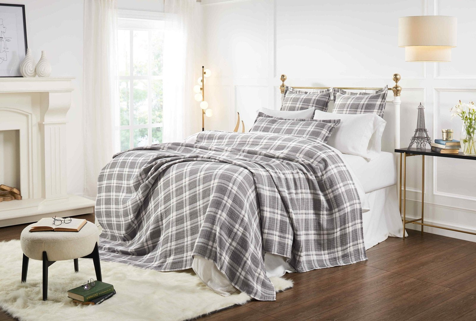 BT-116-11096_5|Stylish grey and white plaid blanket elegantly draped on a bed, creating a cozy and inviting atmosphere.