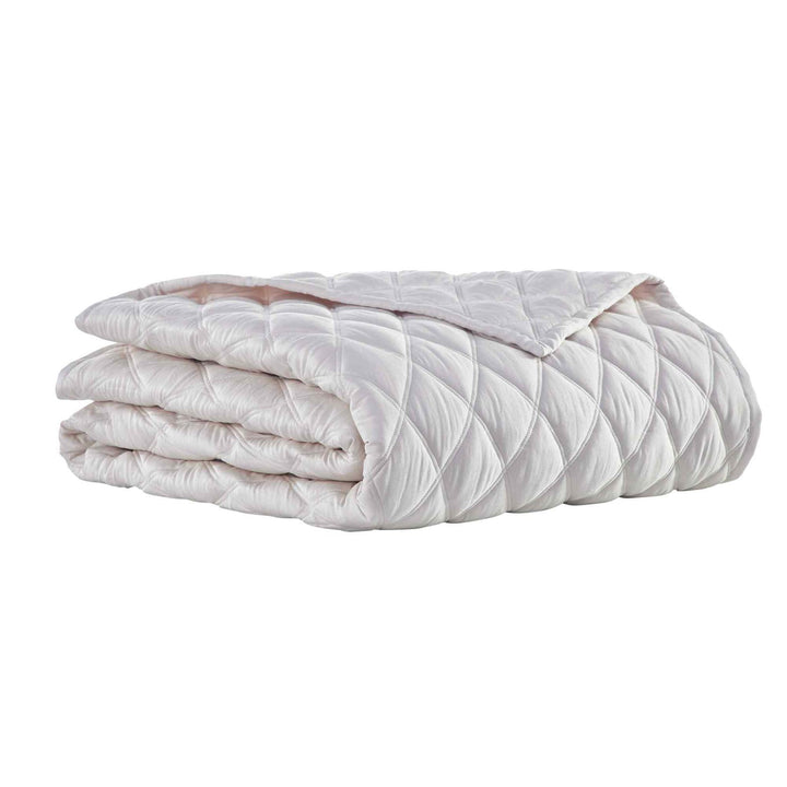CL-180-11096_6|Neatly folded cream diamond-quilted coverlet, showcasing its elegant texture and design. Ideal for stylish bedding.