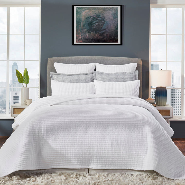 CL-187-11096_1|Crisp white quilted coverlet on a modern bed, enhancing bedroom decor with soft texture, comfort, and fresh elegance.