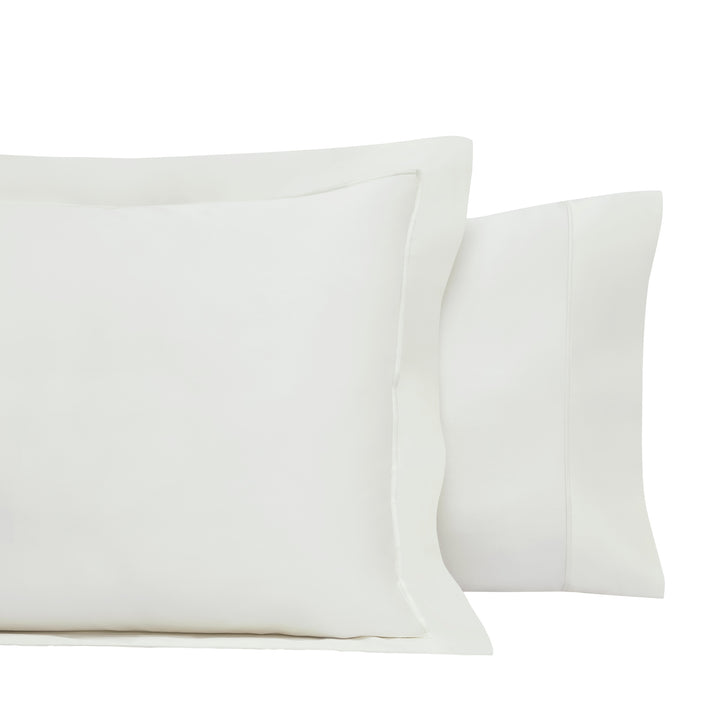 ASP-545-2032_4|Two white 100% cotton pillow shams, one with a decorative flange border and one with a simple hem border.