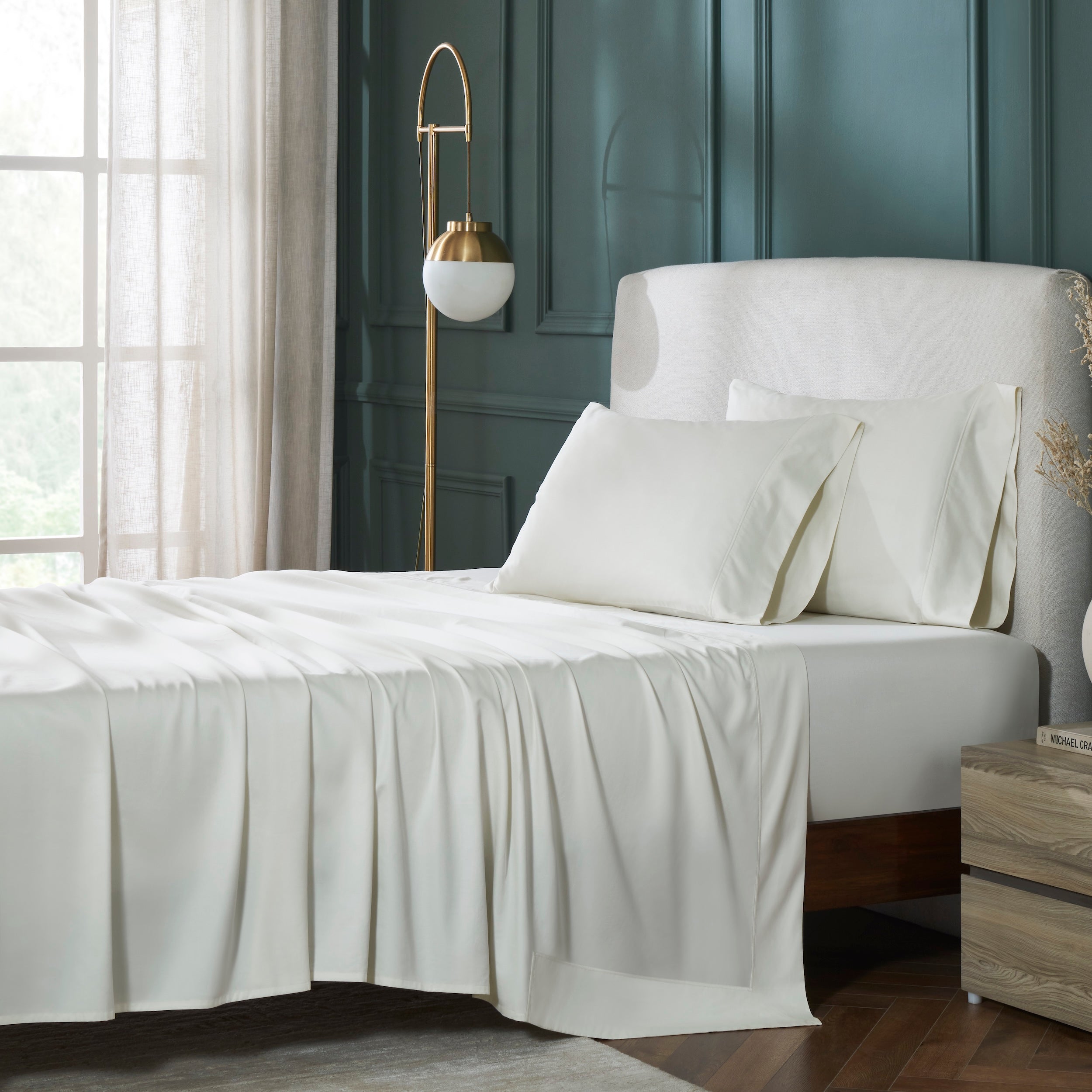 KFL-545-7880_1|Neatly made bed with soft cream 100% cotton sheets and pillows, creating an elegant, luxurious, and breathable sleeping experience.