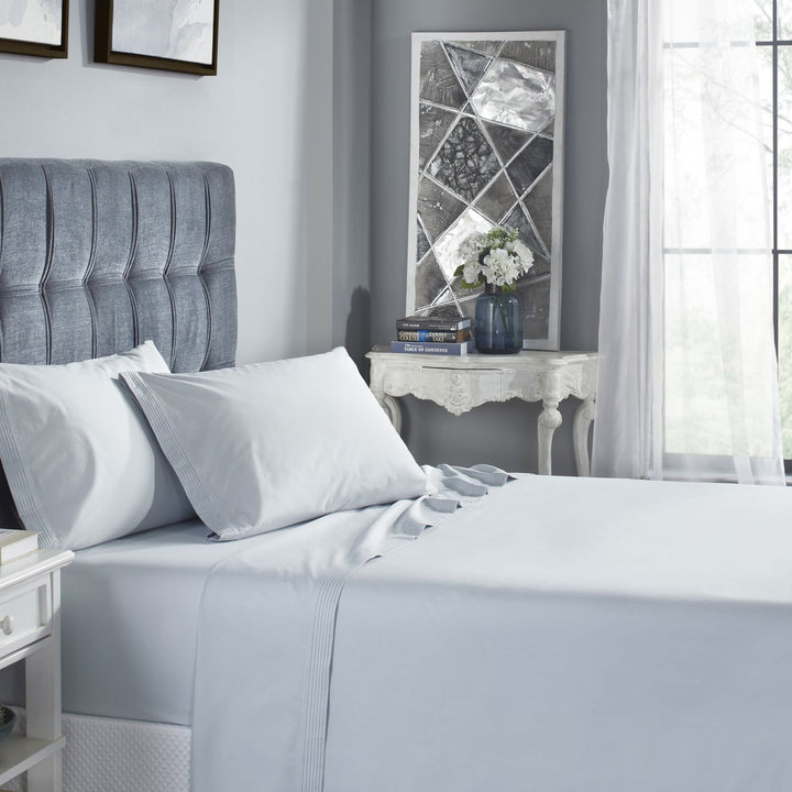 CSS-524-7284_2|Serene light blue 100% cotton sheets on a bed, creating a calming and refreshing bedroom atmosphere. Soft, breathable comfort.