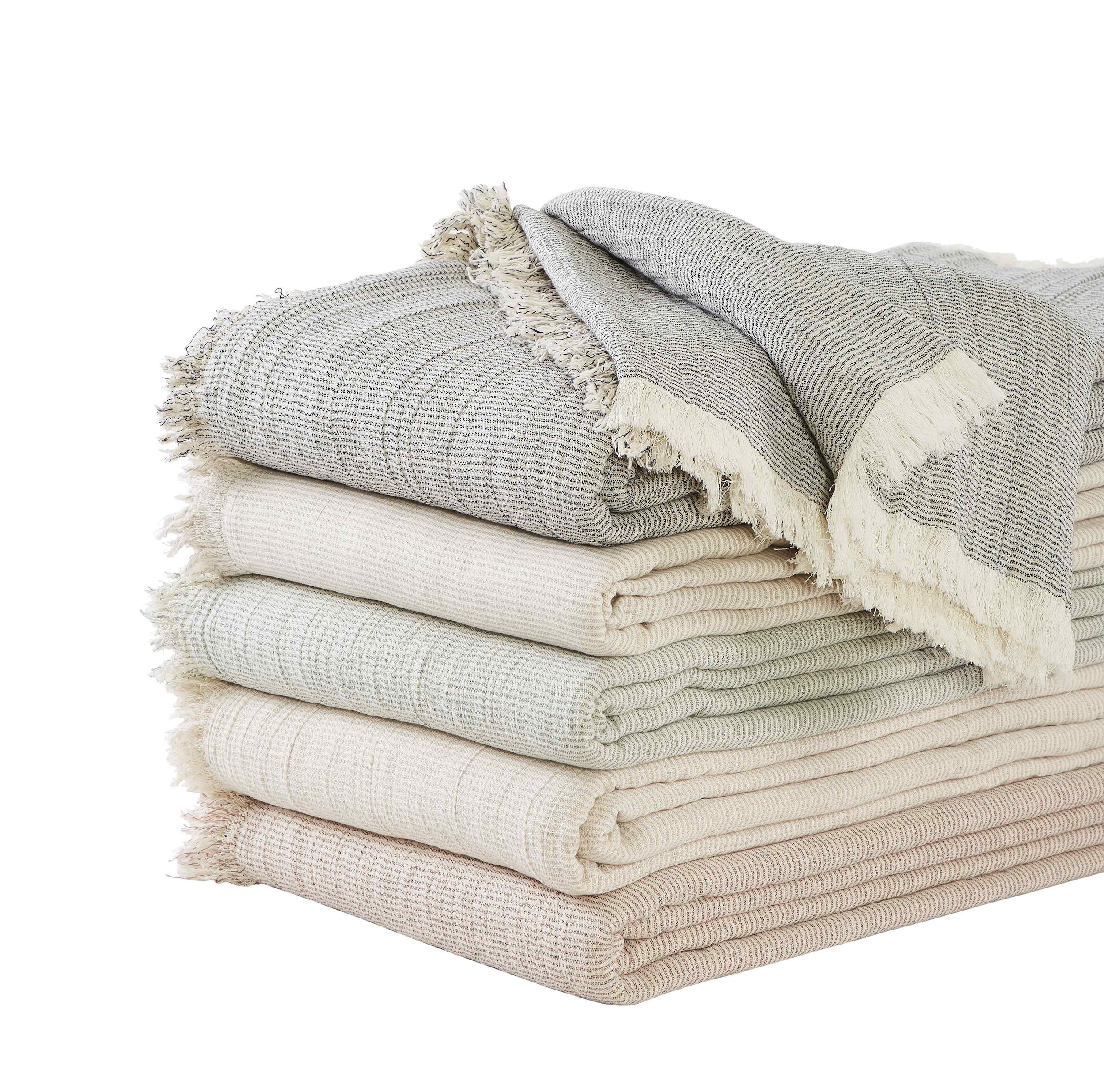 BT-114-9496_5|Stack of cozy neutral-toned striped blankets with stylish fringe edges, perfect for adding warmth and texture to any home decor.