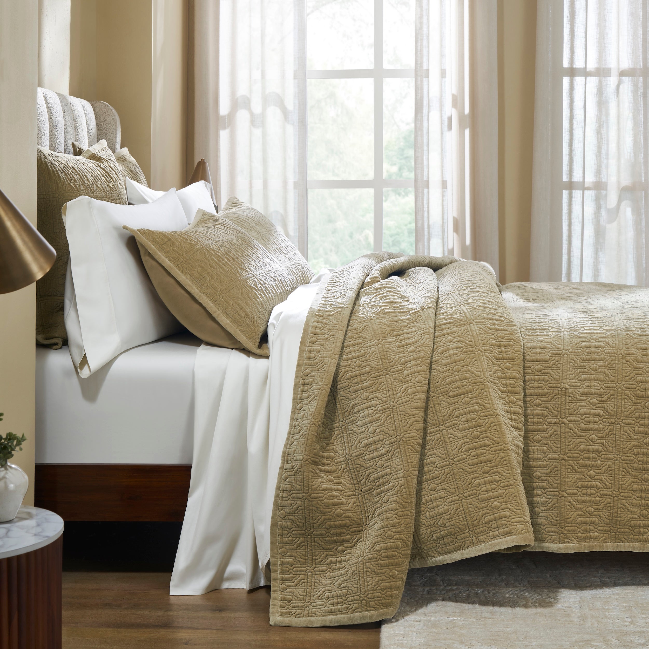 QT-377-9496_3|Elegant tan quilted bedspread with a geometric pattern, draped over a bed with white sheets and pillows, enhancing cozy bedroom decor.