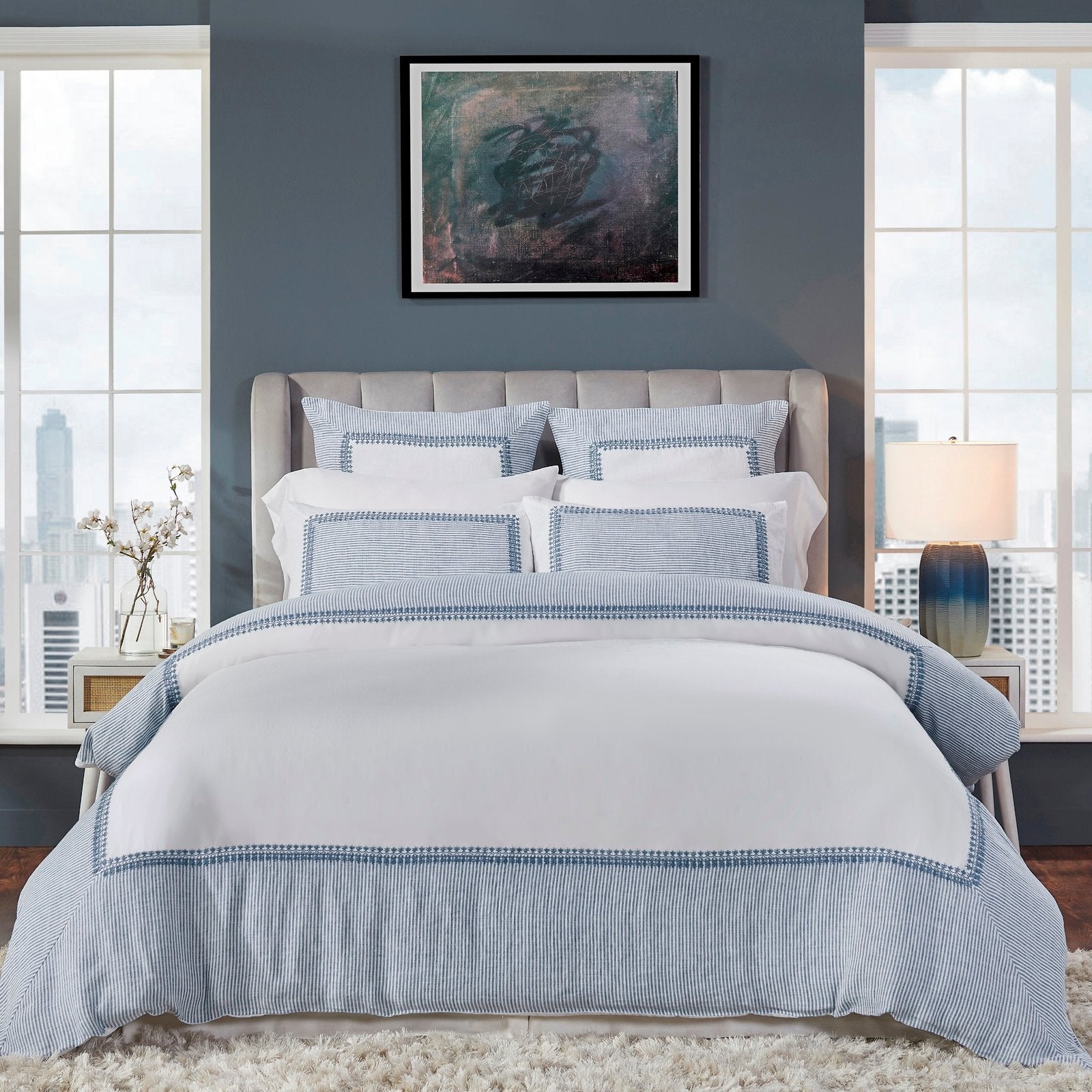DT-030-10692_1|Elegant white duvet cover featuring a sophisticated blue striped border with intricate embroidery, creating a chic, inviting bedroom.