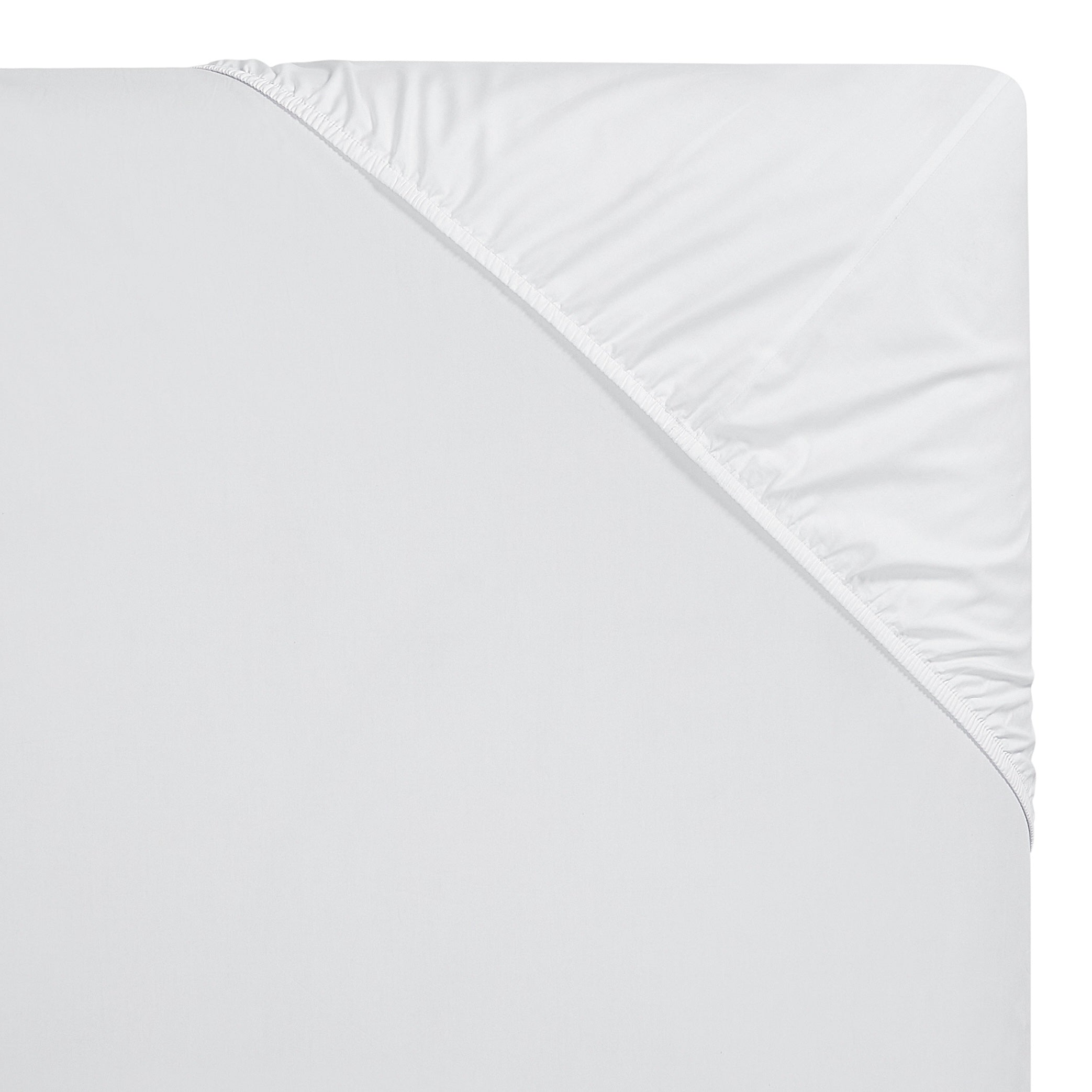 QSS-535-6080_4|Corner view of a crisp white 100% cotton fitted sheet with elastic, showing deep pockets and quality stitching.