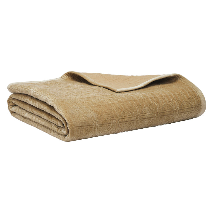 QT-377-9496_8|Neatly folded tan quilt with a subtle embossed geometric pattern, perfect for adding warmth and sophisticated style to any bed.