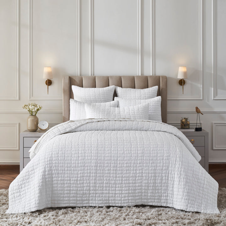 QT-372-X_1|Full bed styled with a white quilted bedspread, shams, and decorative pillows. Clean, minimalist, and serene bedroom decor.