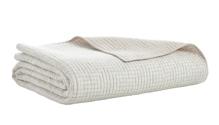 CL-259-11096_7|Creamy white textured waffle weave coverlet folded neatly, showcasing its soft, inviting fabric and simple elegance.