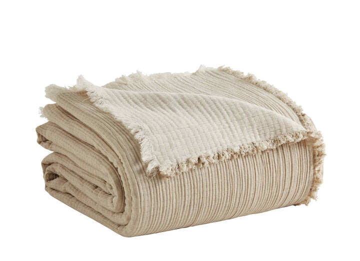 BT-101-9496_2|Folded beige textured blanket with a stylish fringe edge, perfect for cozying up. Soft, natural tone throw for elegant home decor.