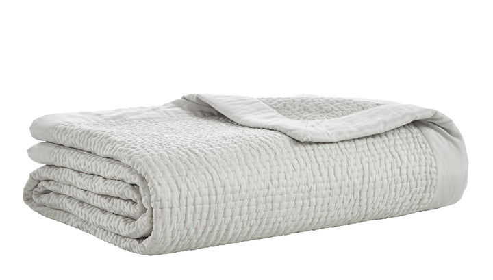 CL-197-11096_5|Neatly folded light grey quilted coverlet, featuring a distinctive waffle texture, offering soft and versatile bedding.