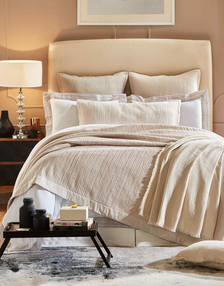 CL-161-9496_1|Elegant beige textured coverlet on a king-size bed, beautifully styled with complementary pillows for a cozy bedroom.