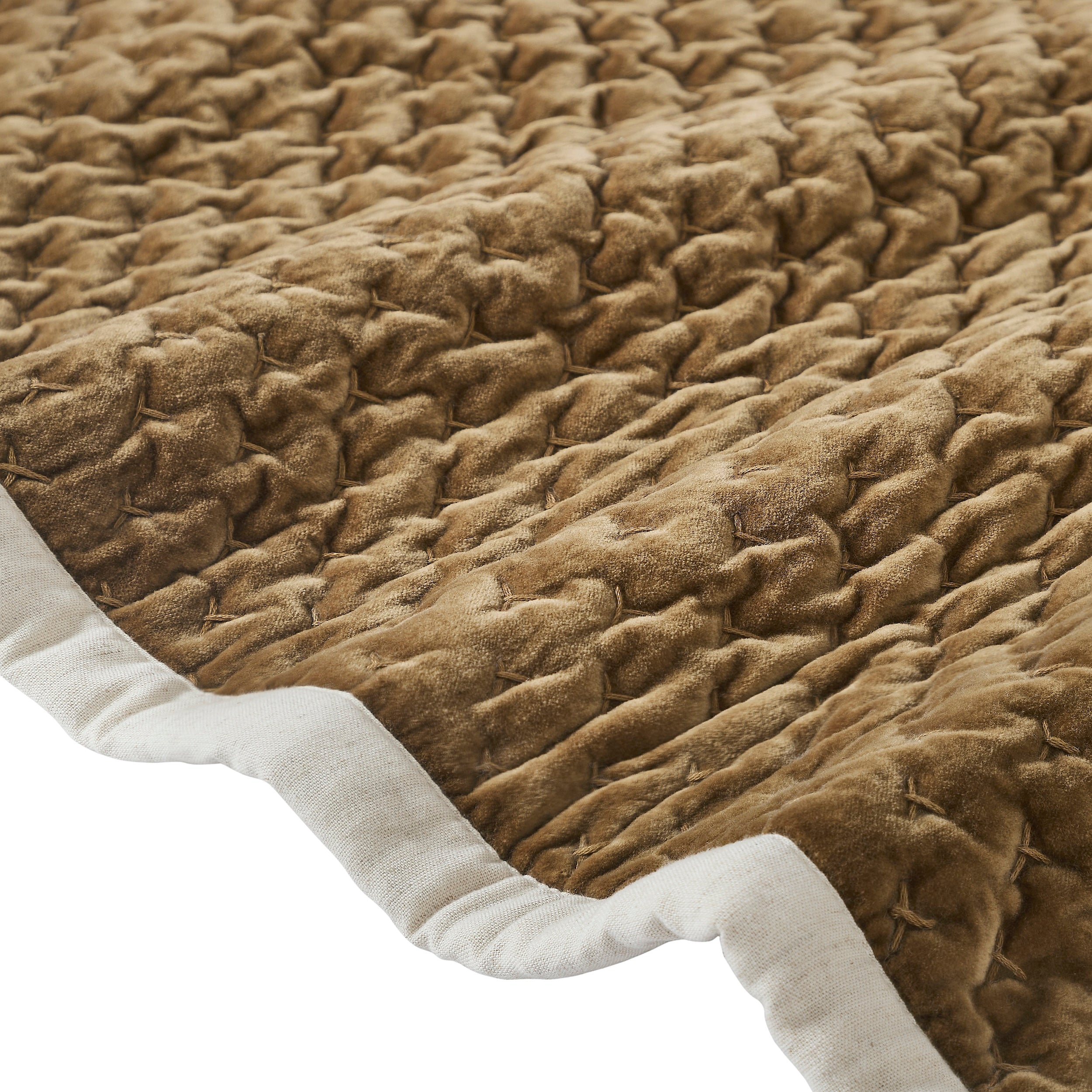 QT-378-11096_8|Close-up of golden-brown quilted bedspread fabric with a distinctive textured pattern and cream border.