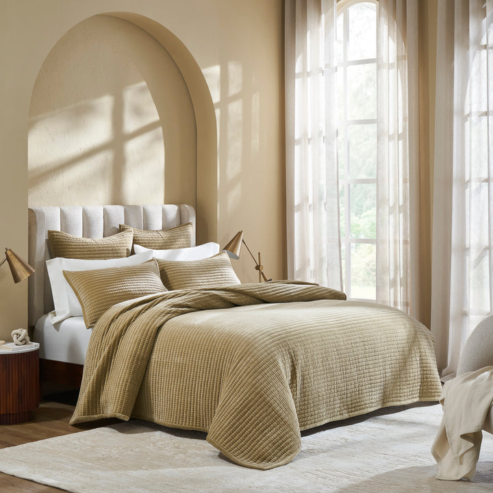 CL-267-9496_2|Luxurious gold quilted velvet coverlet accenting a stylish bedroom setting, providing a cozy and elegant bedding solution.
