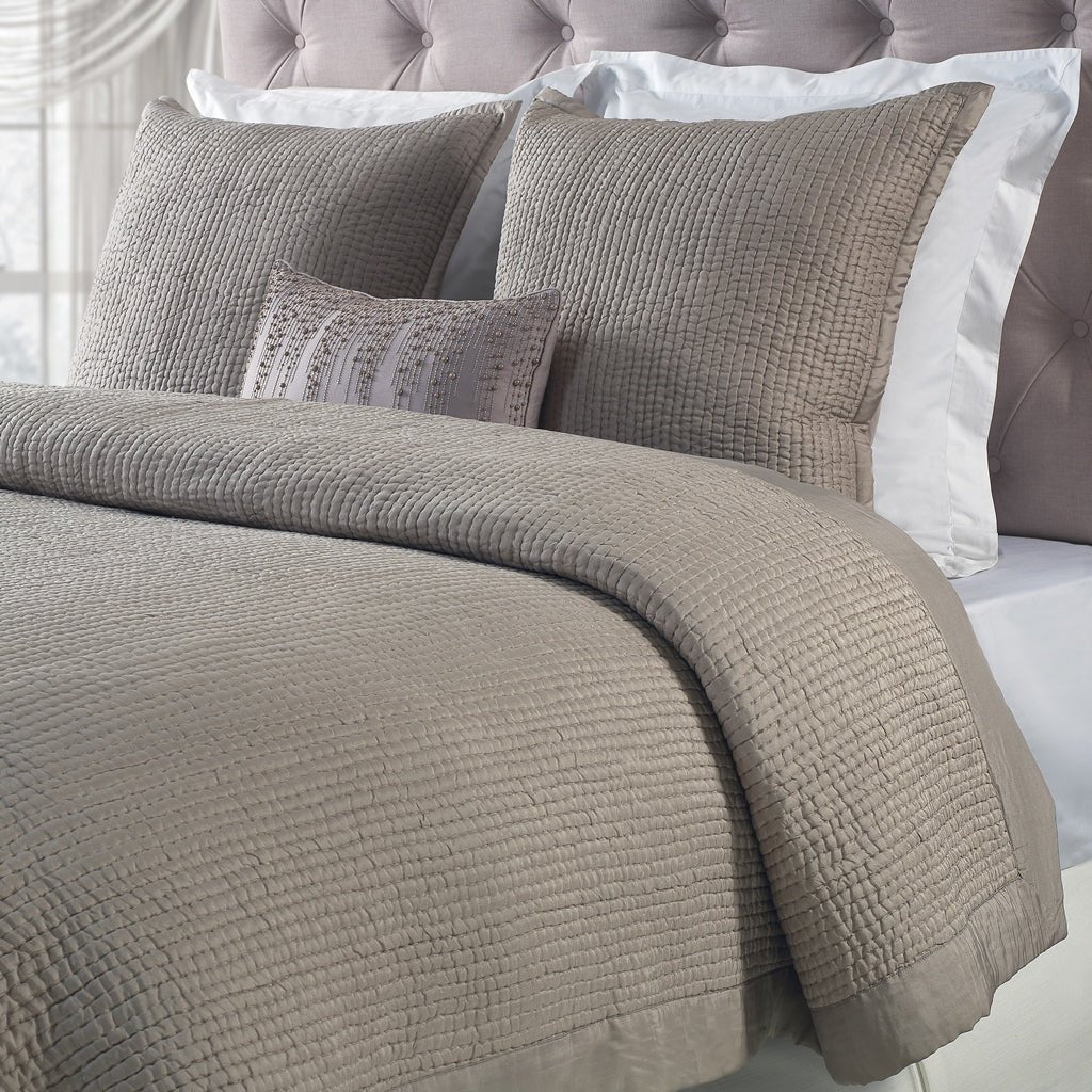 CL-155-7290_1|Elegant beige crinkle-textured quilted coverlet and matching shams, creating a cozy and inviting bedroom aesthetic.