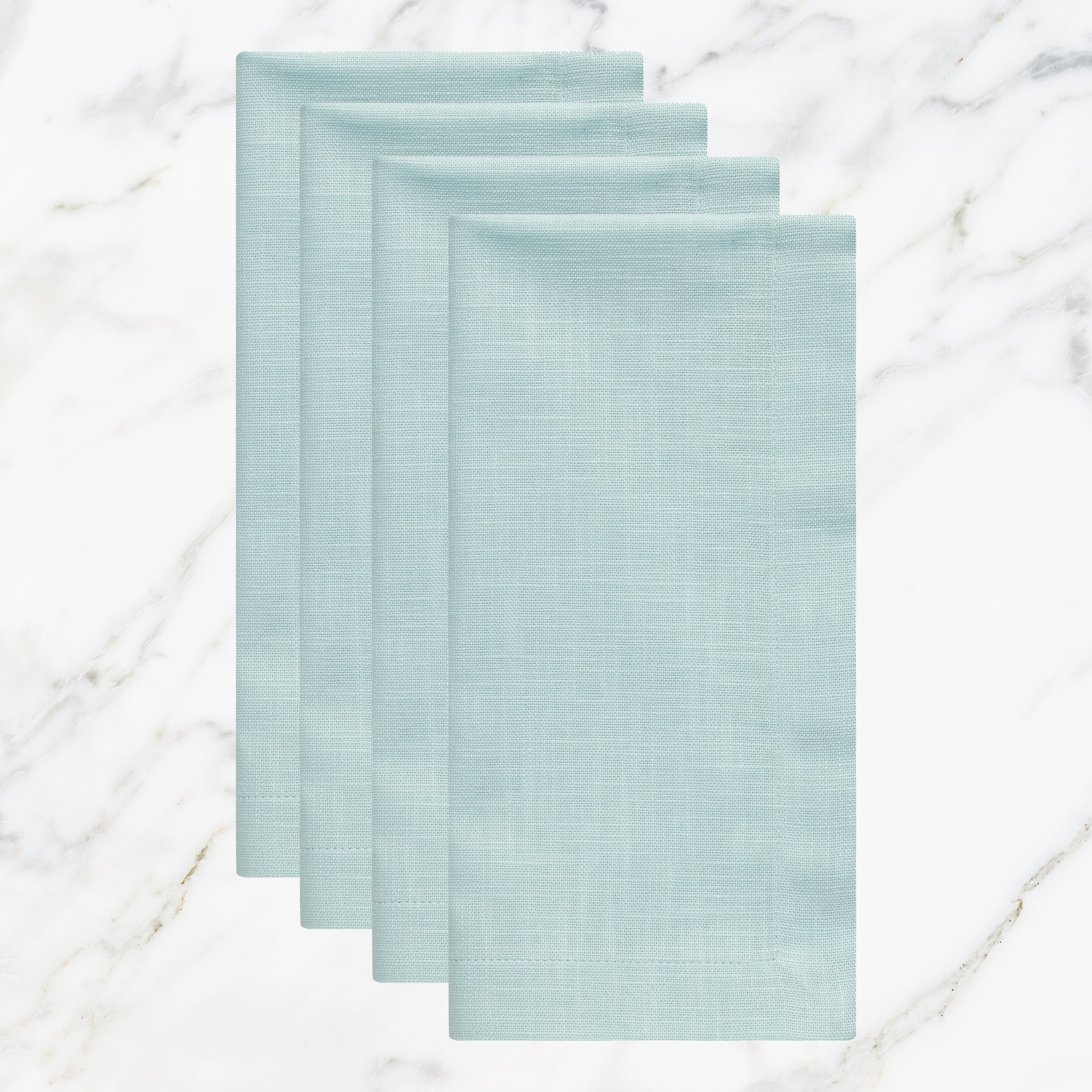 NP-4803-2020_1|Set of four folded aqua blue linen-blend napkins on marble. Stylish reusable cloth for weddings, parties, and daily meals.