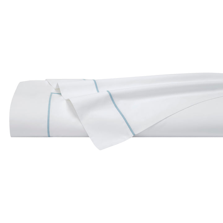 TFL-530-3980_5|Expertly folded white 100% cotton sheet set with refined light blue piping, ready for elegant bedroom presentation.