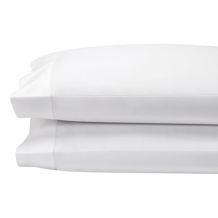 AKP-533-2040_2|Two plush white 100% cotton pillowcases stacked, showcasing luxurious softness and premium bedding quality.