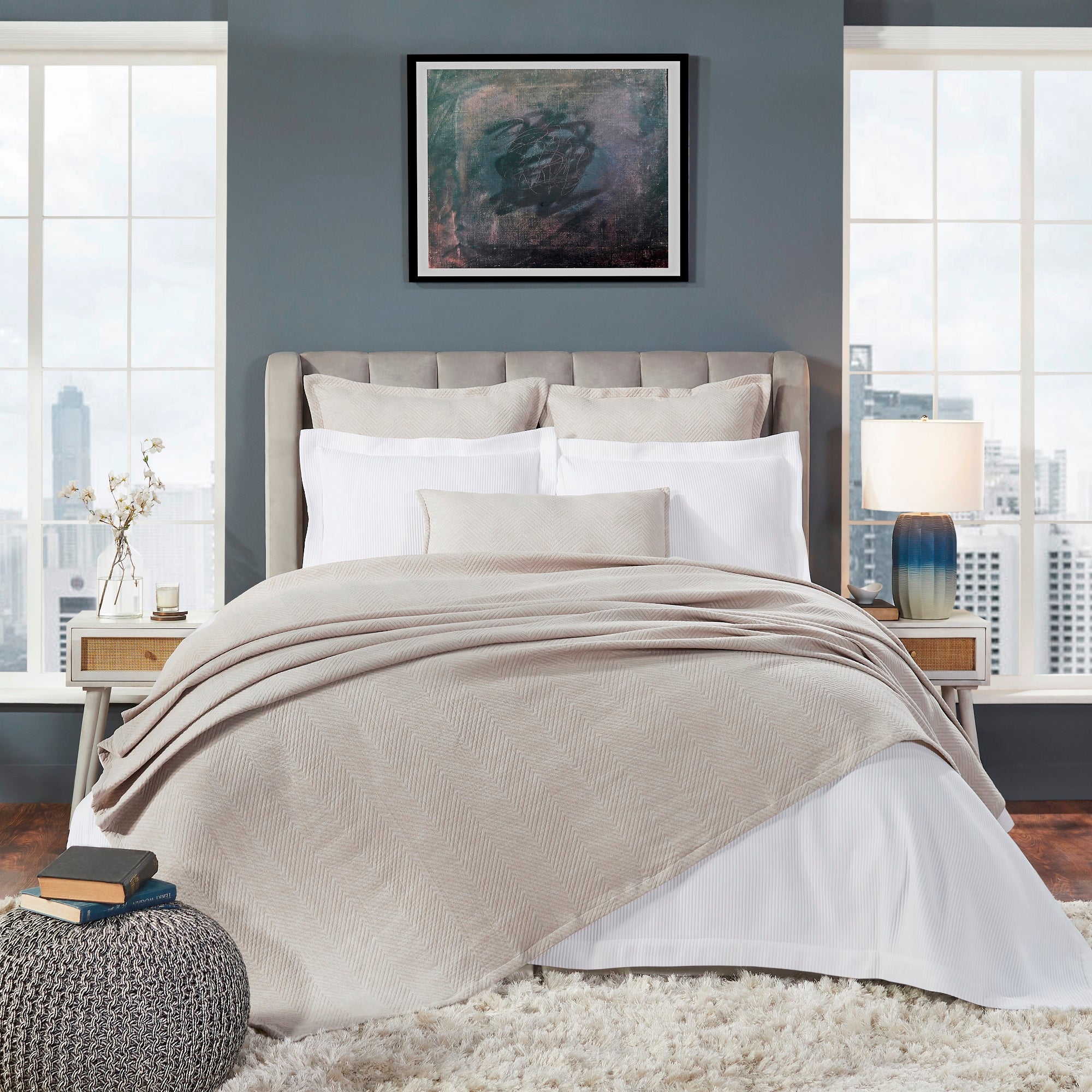 BT-122-9496_1|Elegant light beige chevron patterned blanket draped on a modern bed, creating a warm, inviting ambiance.