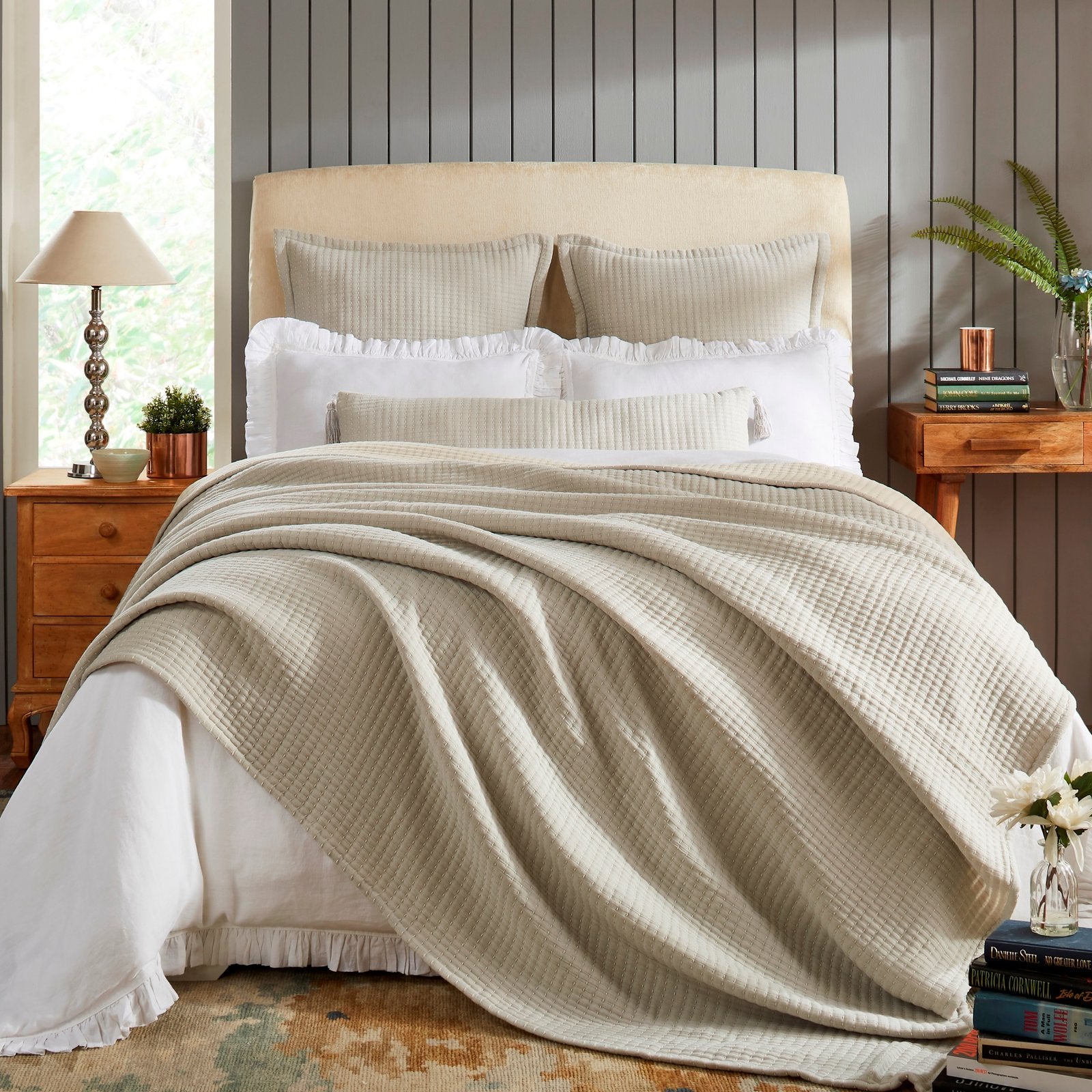 BT-107-9496_1|Cozy beige textured reversible quilt blanket elegantly draped over a bed with white sheets, perfect for inviting bedroom decor.