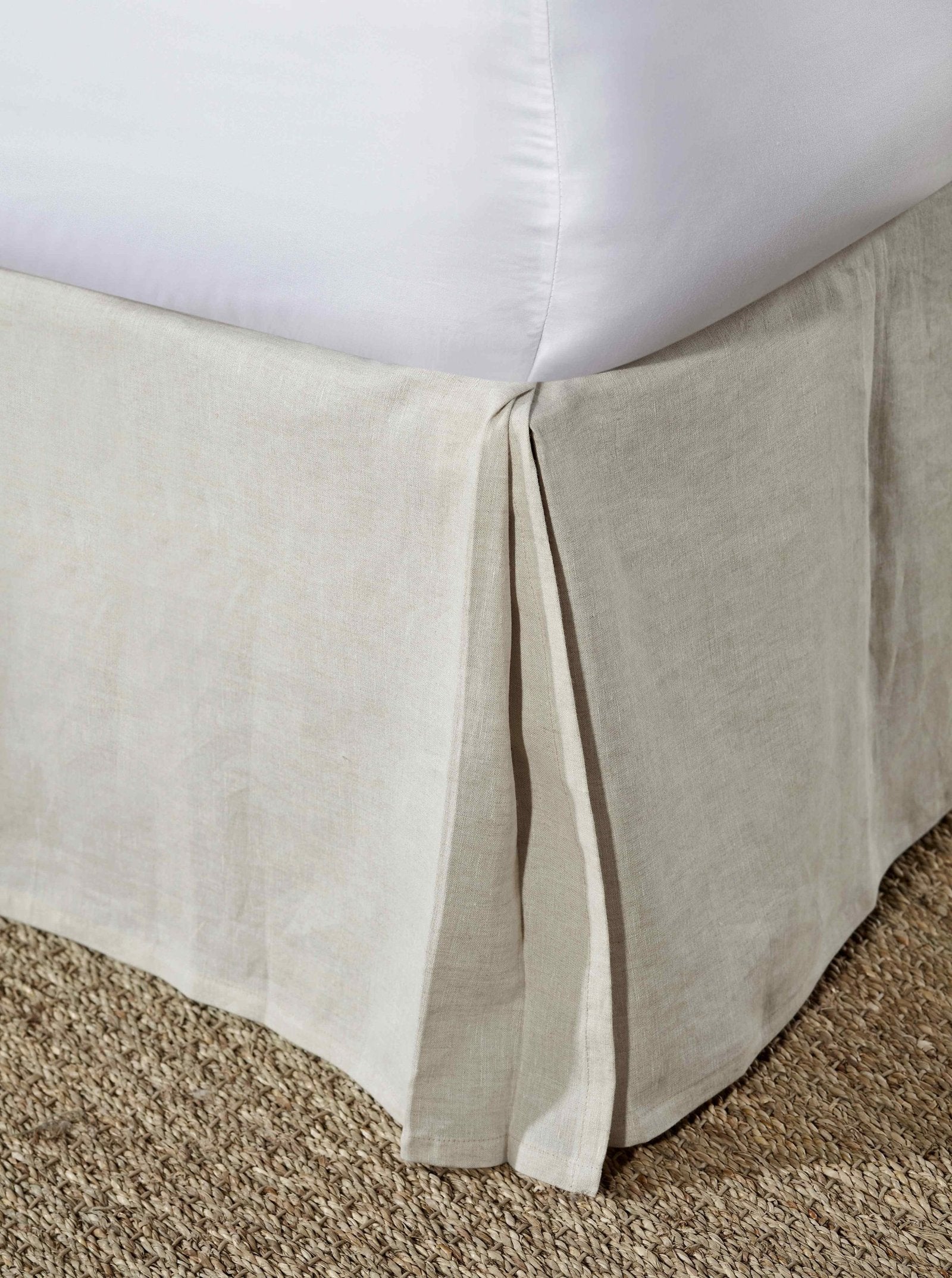 BS-102-7880_1|Close-up of a natural linen-blend pleated bed skirt in a neutral tone, providing a tailored and elegant finish for any bed.