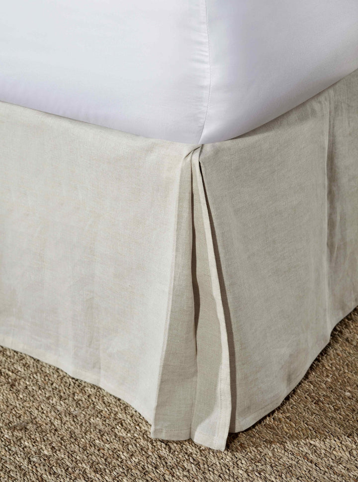 BS-102-7880_1|Close-up of a natural linen-blend pleated bed skirt in a neutral tone, providing a tailored and elegant finish for any bed.