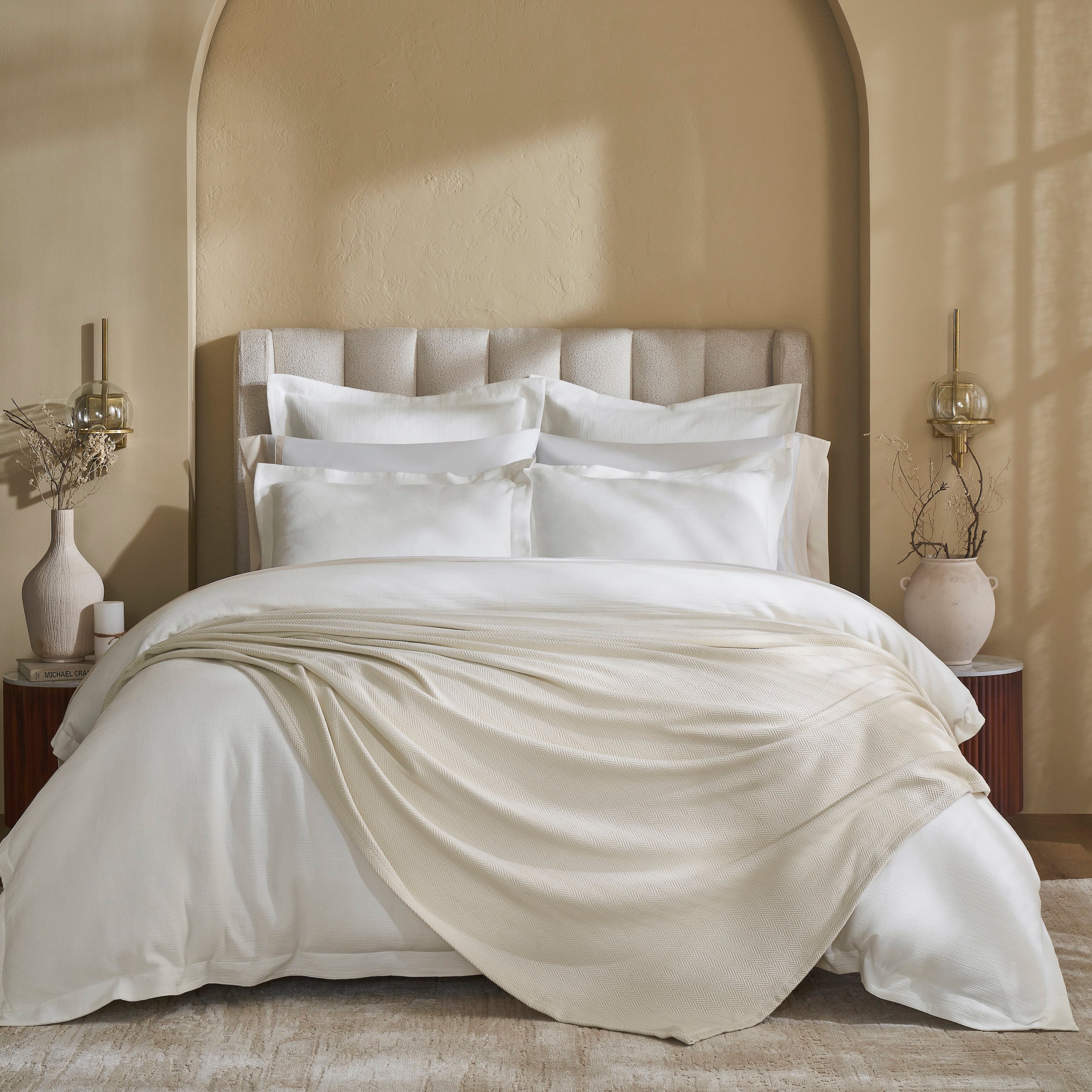 BL-866-9496_1|Elegant light beige waffle weave blanket draped decoratively on a luxurious bed with white bedding, adding warmth and style.