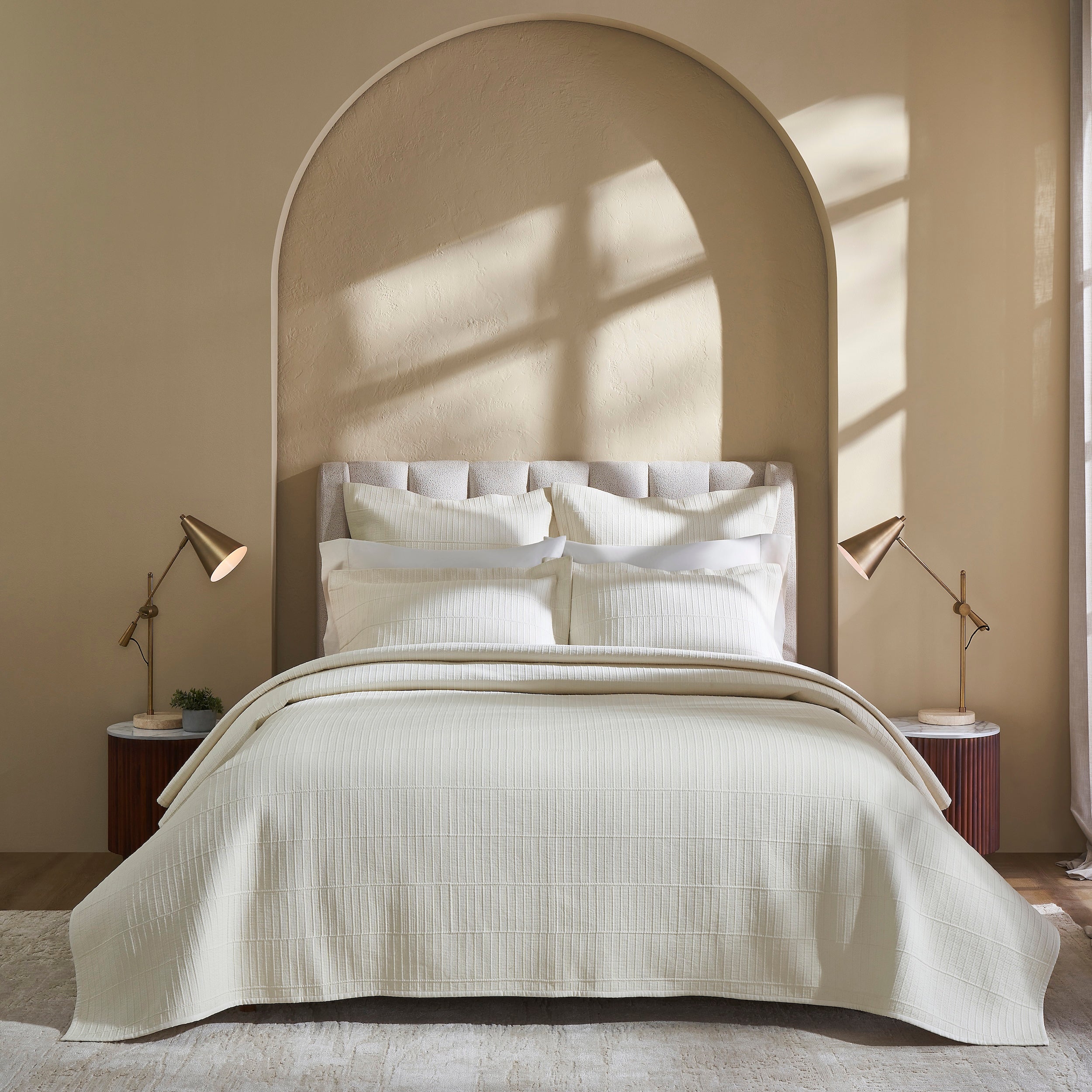 CL-271-9496_2|Luxurious cream textured coverlet with subtle grid pattern, draped elegantly on a bed, offering sophisticated comfort for modern bedrooms.