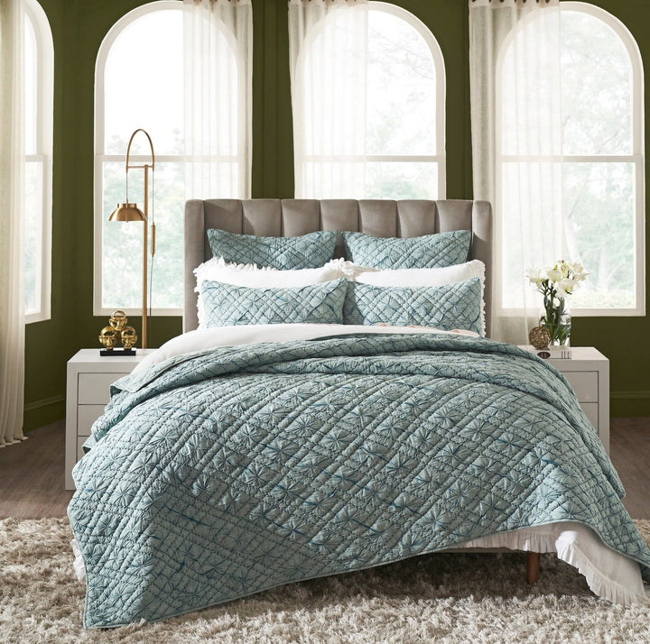 QT-365-9496_1|Vibrant teal blue quilt featuring intricate geometric quilting, beautifully styled on a bed, perfect for a fresh bedroom look.