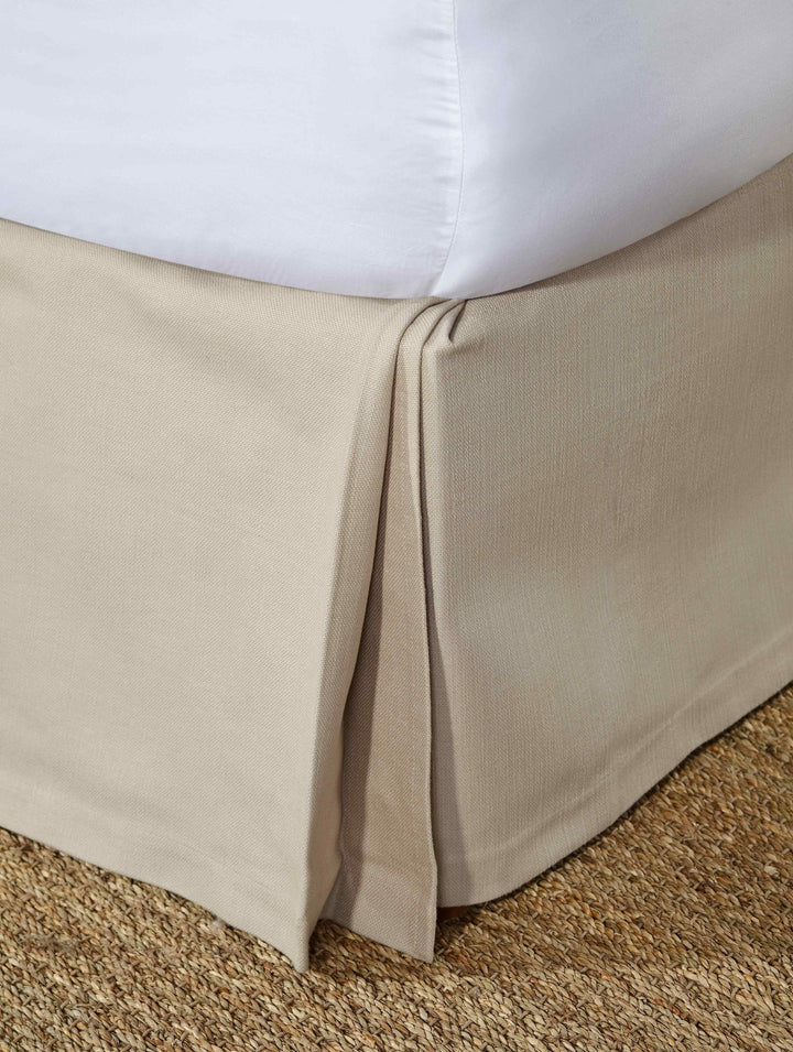 BS-109-7880_1|Light beige panel bed skirt featuring clean box pleats, providing a sophisticated and neat look to any bedroom setting.