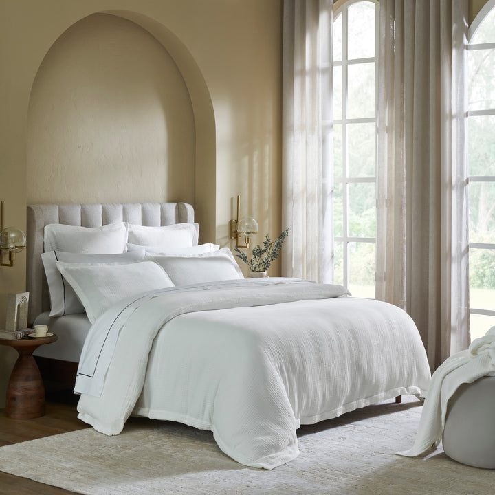 DT-048-10692_2|Elegant white textured duvet cover and complementary bedding set on a modern bed in a sunlit room, enhancing bedroom comfort.