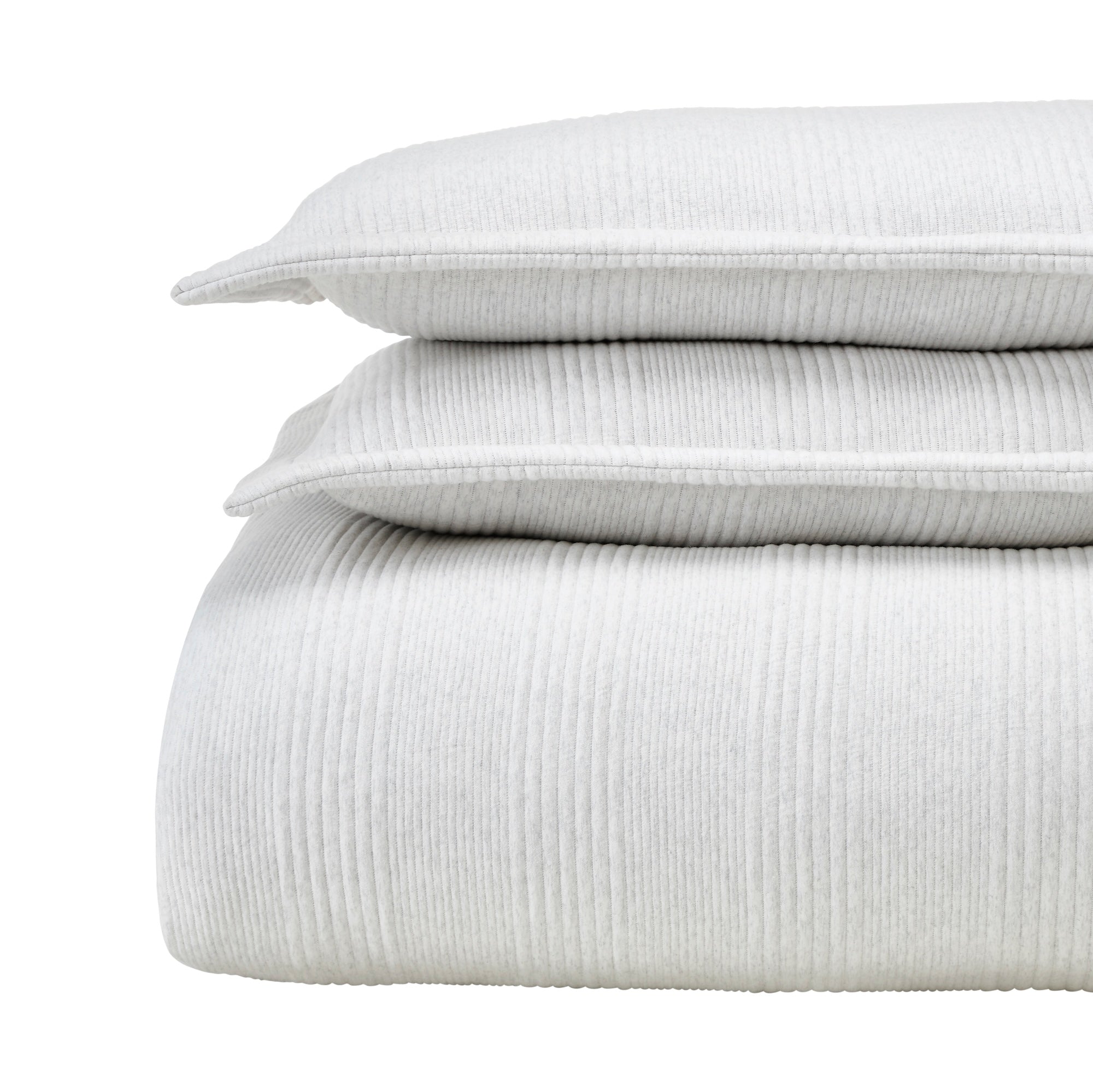 DT-043-9092_5|Stacked light grey ribbed duvet cover, two matching pillows, neatly folded, presenting soft, luxurious bedding.