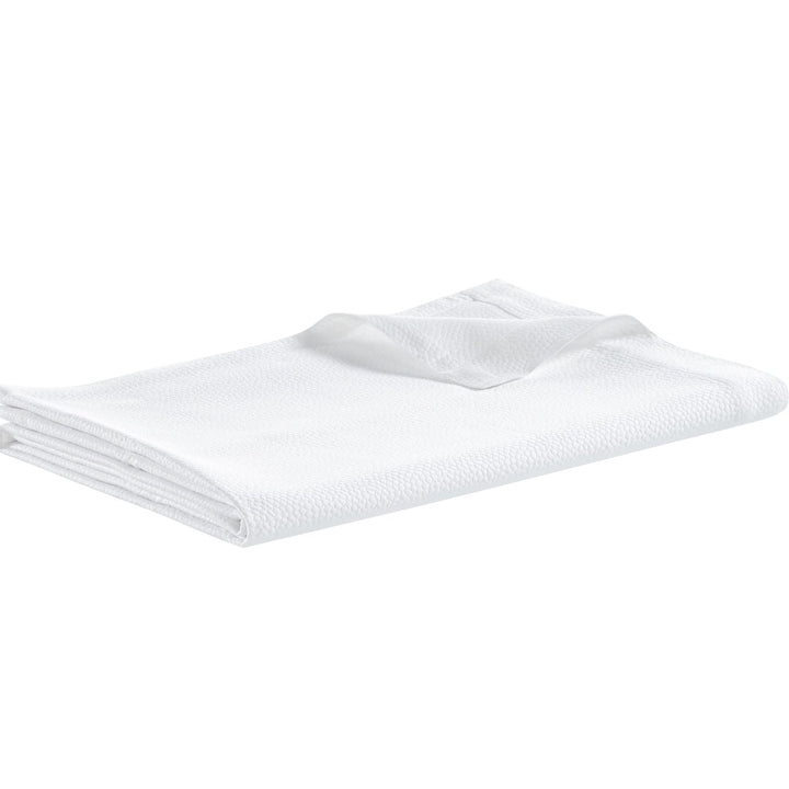 CL-258-11096_5|Crisp white coverlet featuring a delicate, subtle dimpled texture for a modern and clean bedroom design.