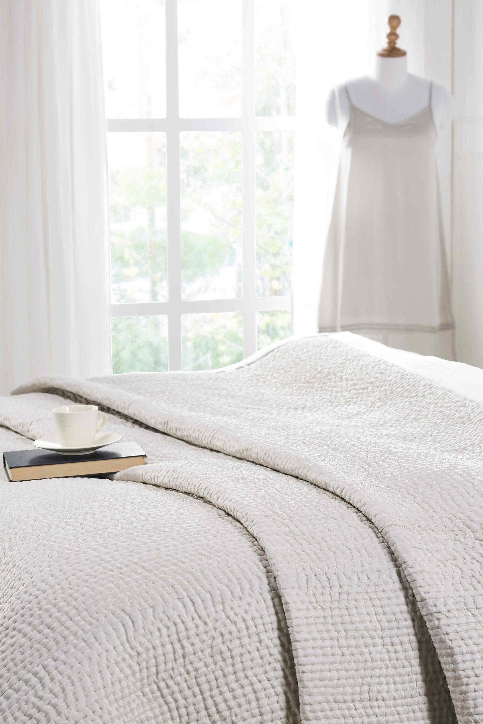 CL-166-11096_4|Light grey quilted coverlet featuring a small, irregular waffle-like quilting pattern and clean finish. Close-up detail.