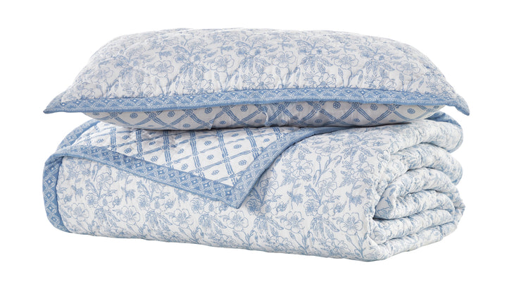 KS-345-2036_2|Stacked white and blue floral patterned quilt and coordinating pillow sham, offering a cohesive, charming bedding set.