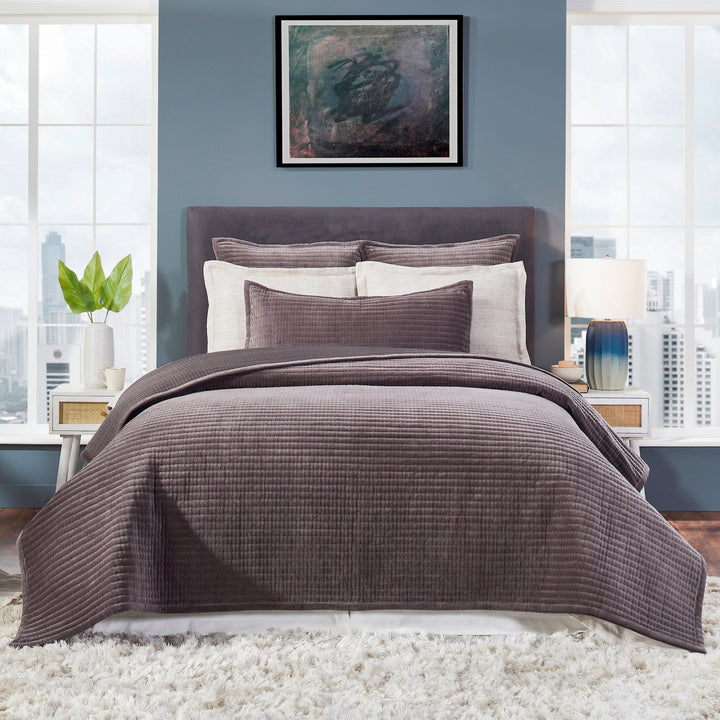 CL-186-9496_1|Plum quilted coverlet on a modern bed, enhancing bedroom decor with soft texture, comfort, and sophisticated elegance.