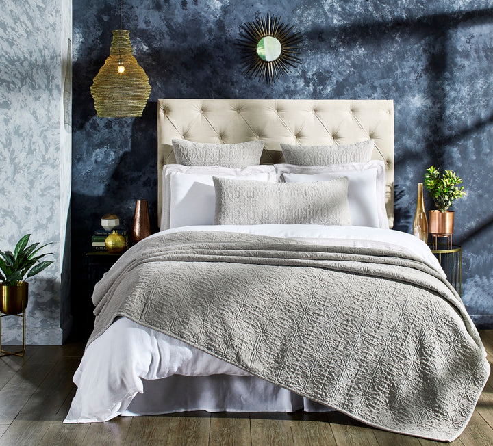 QT-331-11096_3|Sophisticated tan quilted bedspread draped on a modern bed, offering luxurious texture and comfort to the space.