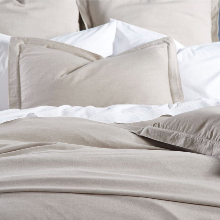 DT-036-10692_4|Close-up of a cozy, plain beige duvet cover and matching pillow shams, providing a comfortable and inviting bed.