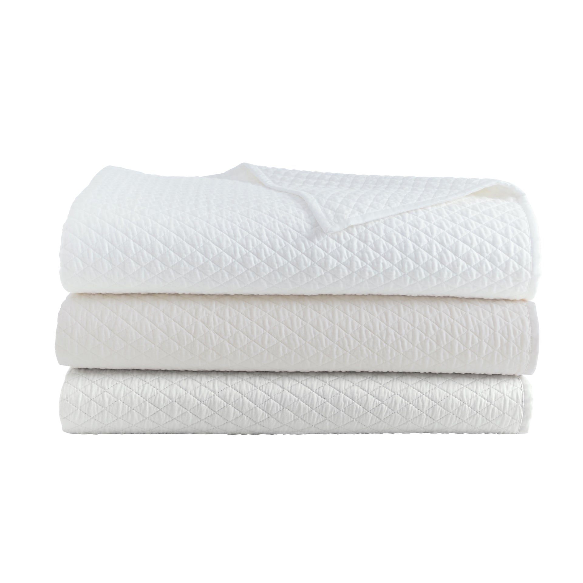 CL-264-X_2|Stack of three soft white textured quilts, offering cozy bedspreads and comfortable bedding essentials for any home.