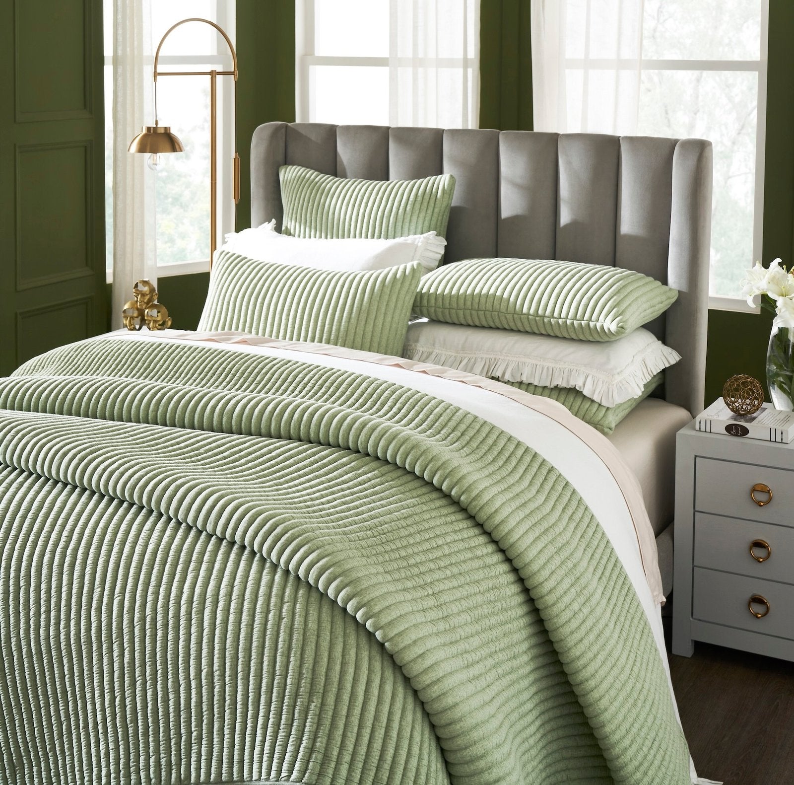 QT-370-11096_3|Close-up of a soft sage green corduroy ribbed quilt, showcasing its plush texture and cozy, inviting design.