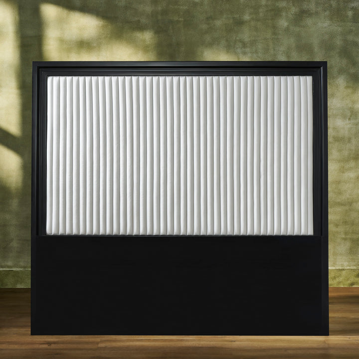 FN-5211-7680_1|Rectangular black framed headboard with a white vertically channel-quilted leather upholstered panel. Features a solid black base.