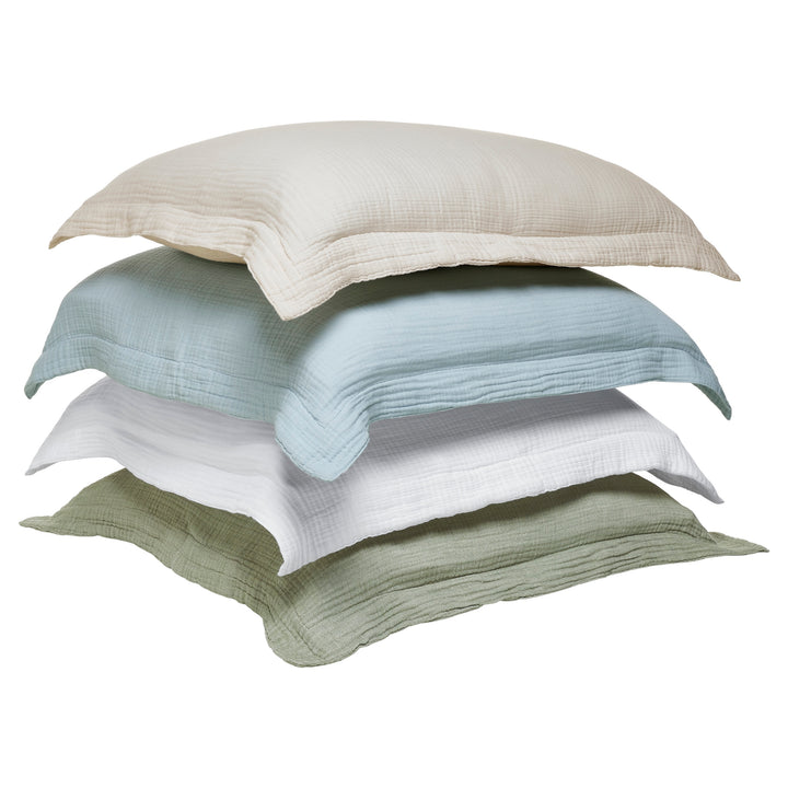 ES-050-2626_5|Stack of textured cotton duvet covers in assorted colors: beige, light blue, white, green. Soft crinkled fabric for versatile styling.